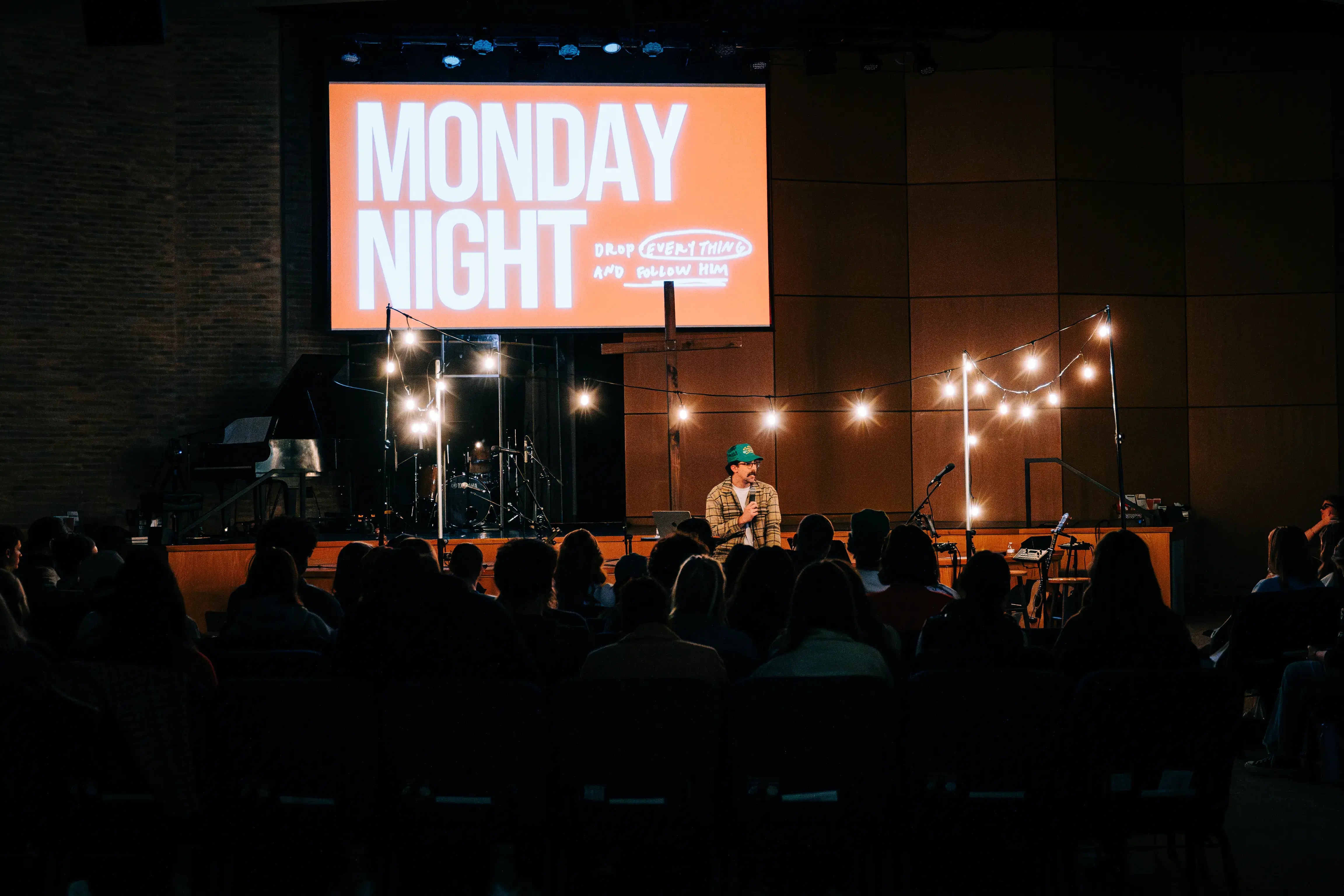 The Monday Night message on screen over a room of college students in Nashville