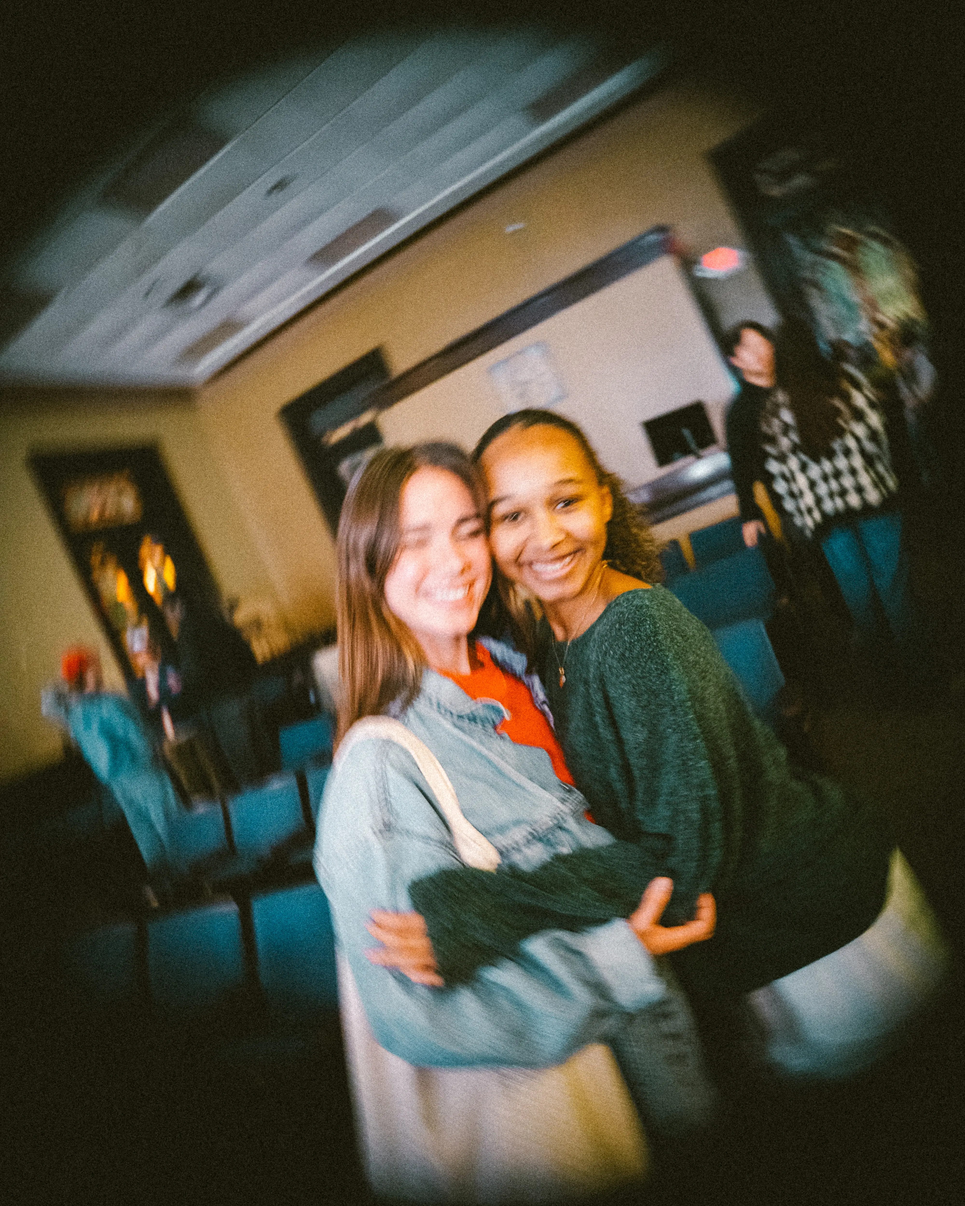 Friends embracing after a Monday Nights gathering