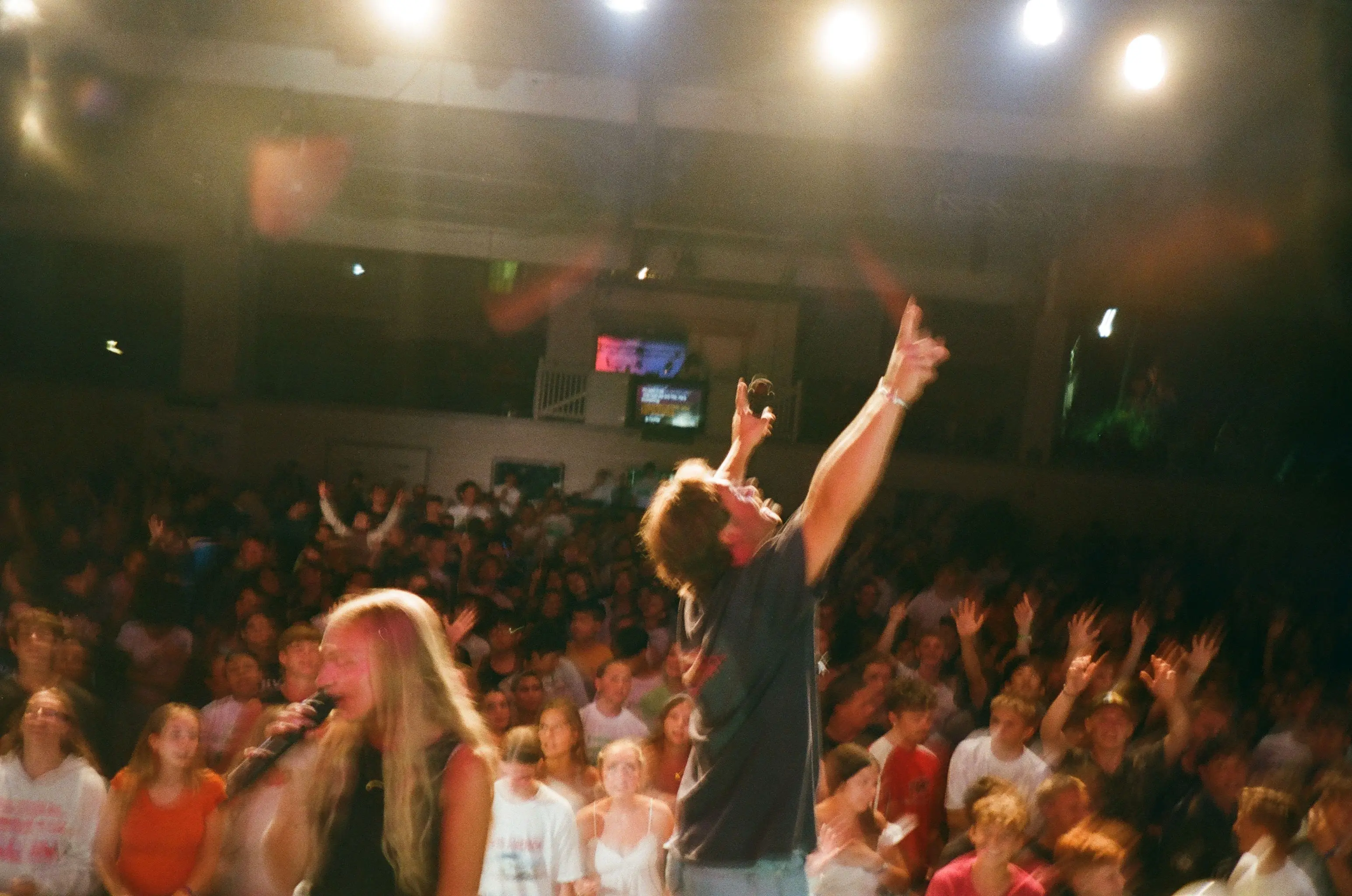 A room full of young adults worshipping in Nashville