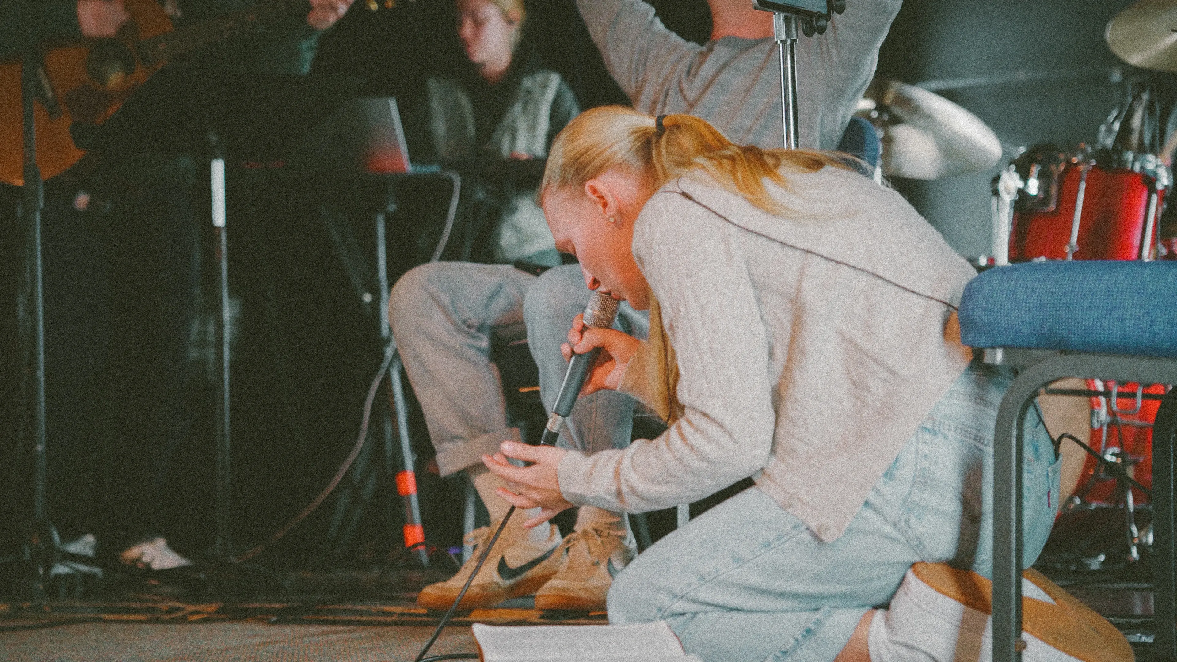 Young adults praying together in the Fire and Fragrance Nashville prayer room